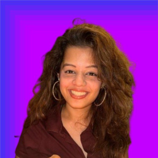 Faye smiling in front of camera